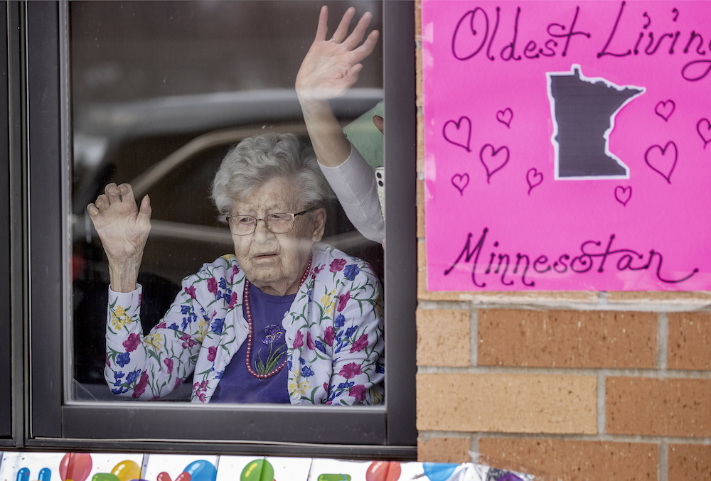 Friends and family celebrated the 112th birthday of Erna Zahn with a parade in front of her window at the Oak Hills Living Center, Tuesday, April 14, 2020 in New Ulm, Minn.