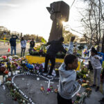 On Thursday, April 22, 2021, in Brooklyn Center, Minn., at the memorial site for Daunte Wright, Lamar Pettis, who is active in the BLM movement, brought his kids, L to R: Lauren,14, Lamar, 9, Lamiyah,9, and Zaniya, 6, to pay their respects