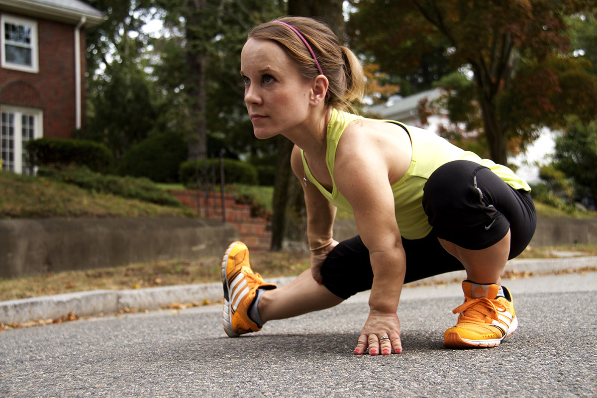 Juli Windsor, a runner with dwarfism, a condition that results in short stature, stretches before a run