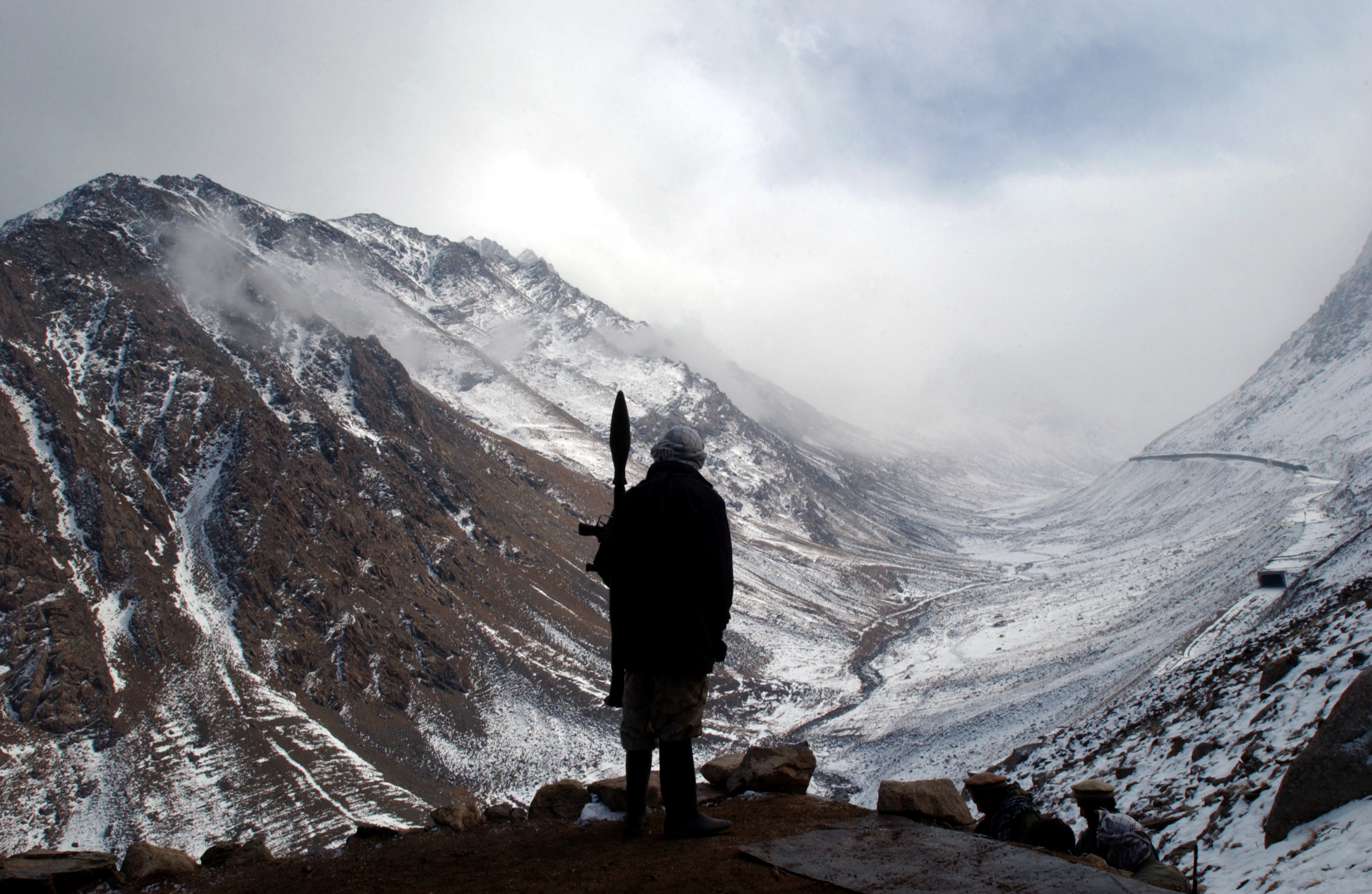 The long-running war in Afghanistan poses coverage challenges. Below, a Northern Alliance soldier in 2001 with a rocket-propelled grenade 