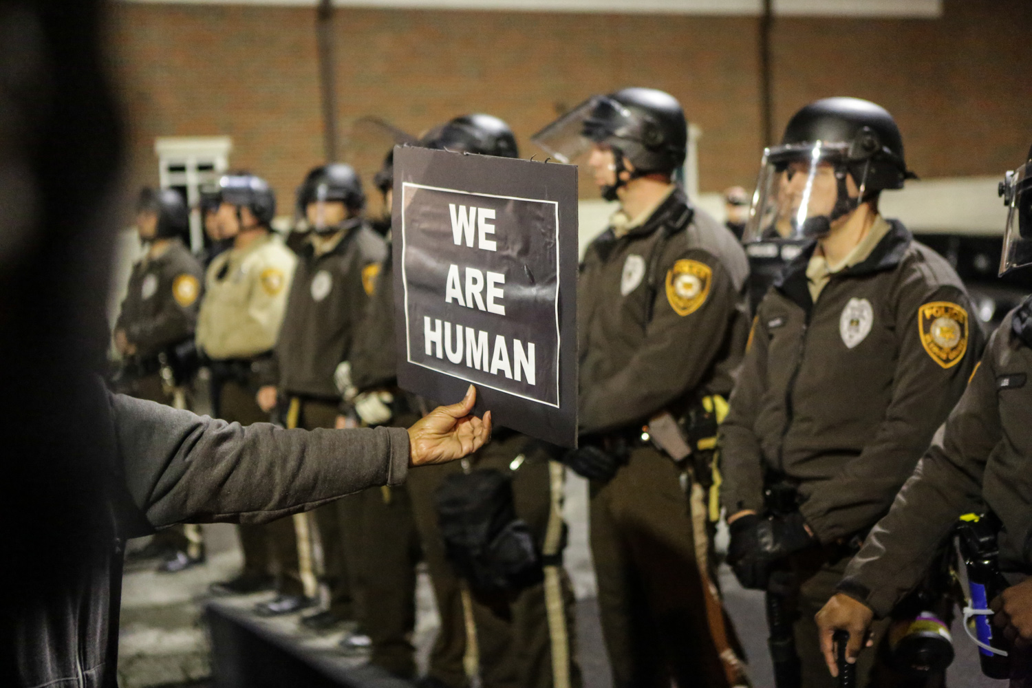 Citizens face law enforcement officers at a protest last October that focused on the Ferguson (Mo.) Police Department 