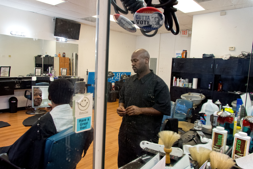 Christopher Williams with his longest-term customer, Melidor (last name not given), a 70 year-old retiree outside St. Louis, Missouri. Williams has been cutting Melidor's hair for over 14 years now. "Change happens slowly and gradually. It takes a lot of patience and hard work. And it's not glamorous. After all the media are gone and people stop talking about Ferguson, we'll still be here working."