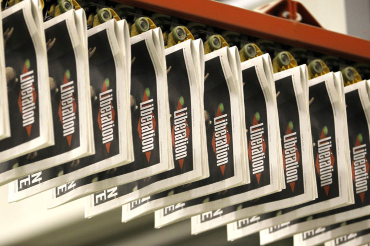 Copies of the French daily newspaper Liberation after early results in the first round vote of the 2012 French presidential election are seen at their printing works 'Paris Offset Print' in La Courneuve near Paris, late April 22, 2012