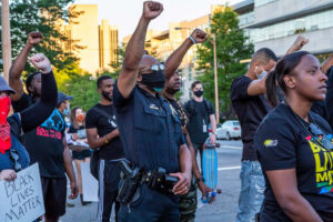 A Little Rock Police officer joins Black Lives Matter protesters