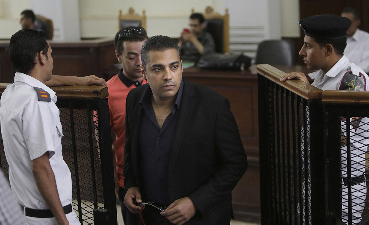 Canadian Al-Jazeera English journalist Mohammed Fahmy during his retrial at a courtroom in Tora prison in Cairo, Egypt. 