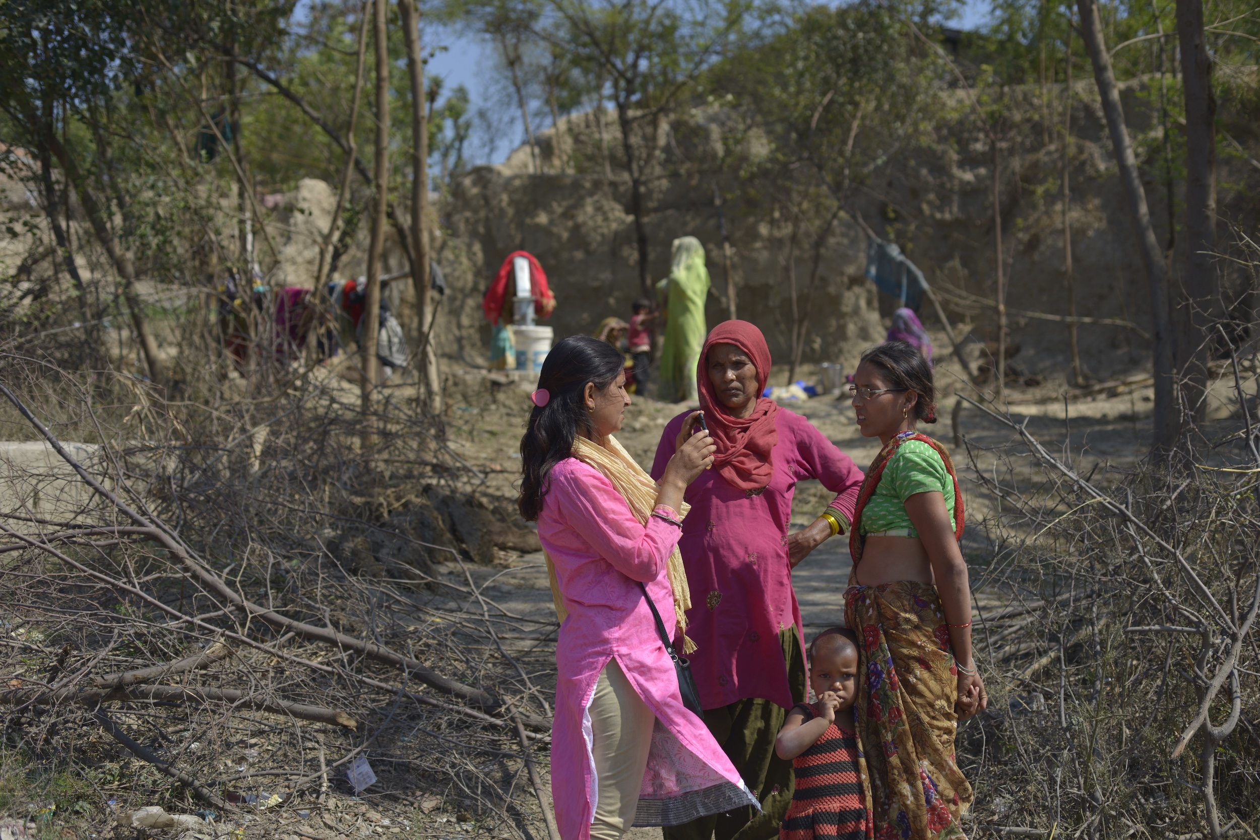 a group of women standing in a forest