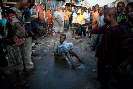 SJ.NIG.02 &#8211; A boy is caught trying to steal pants, Oshodi, Lagos, 2008