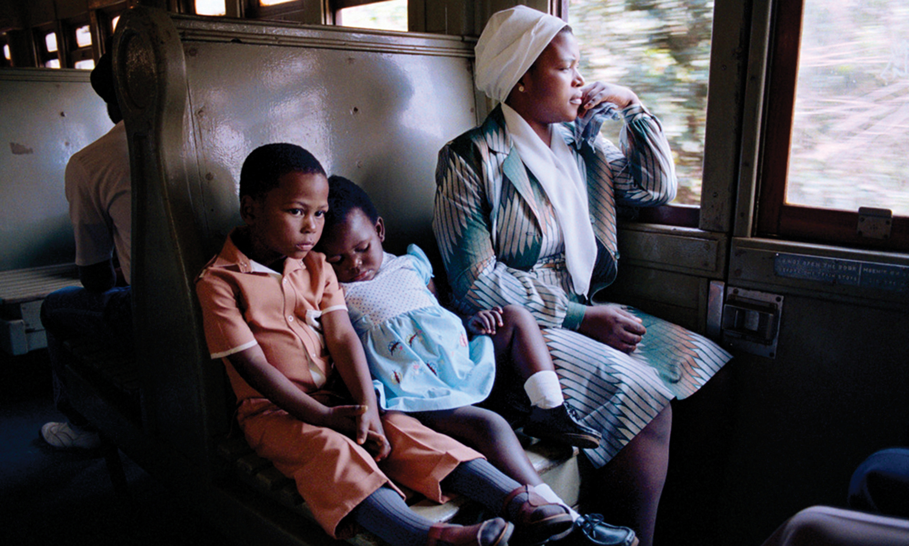 South African Family Traveling on a Train