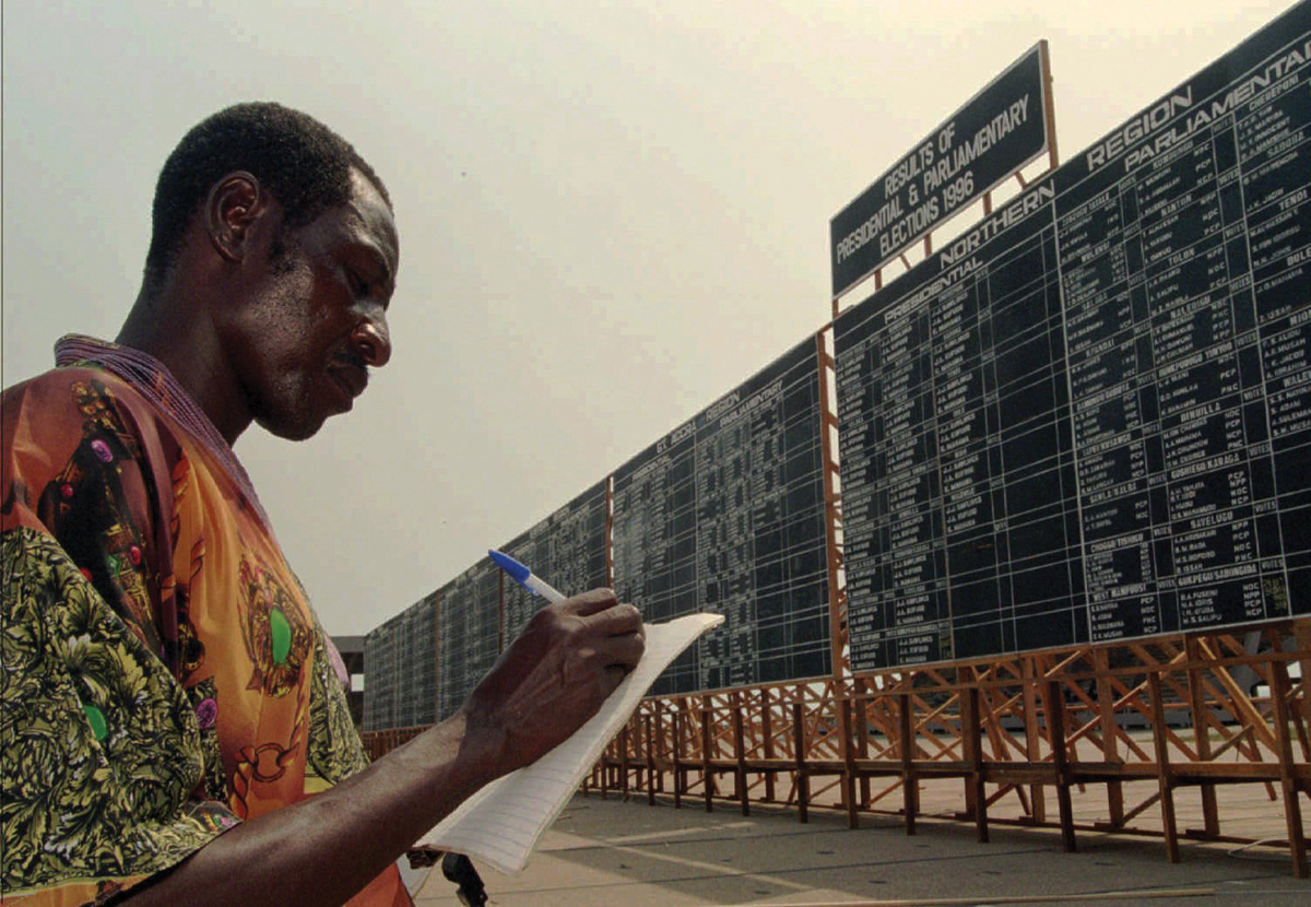 In Accra, Ghana, presidential election results are posted on a scoreboard