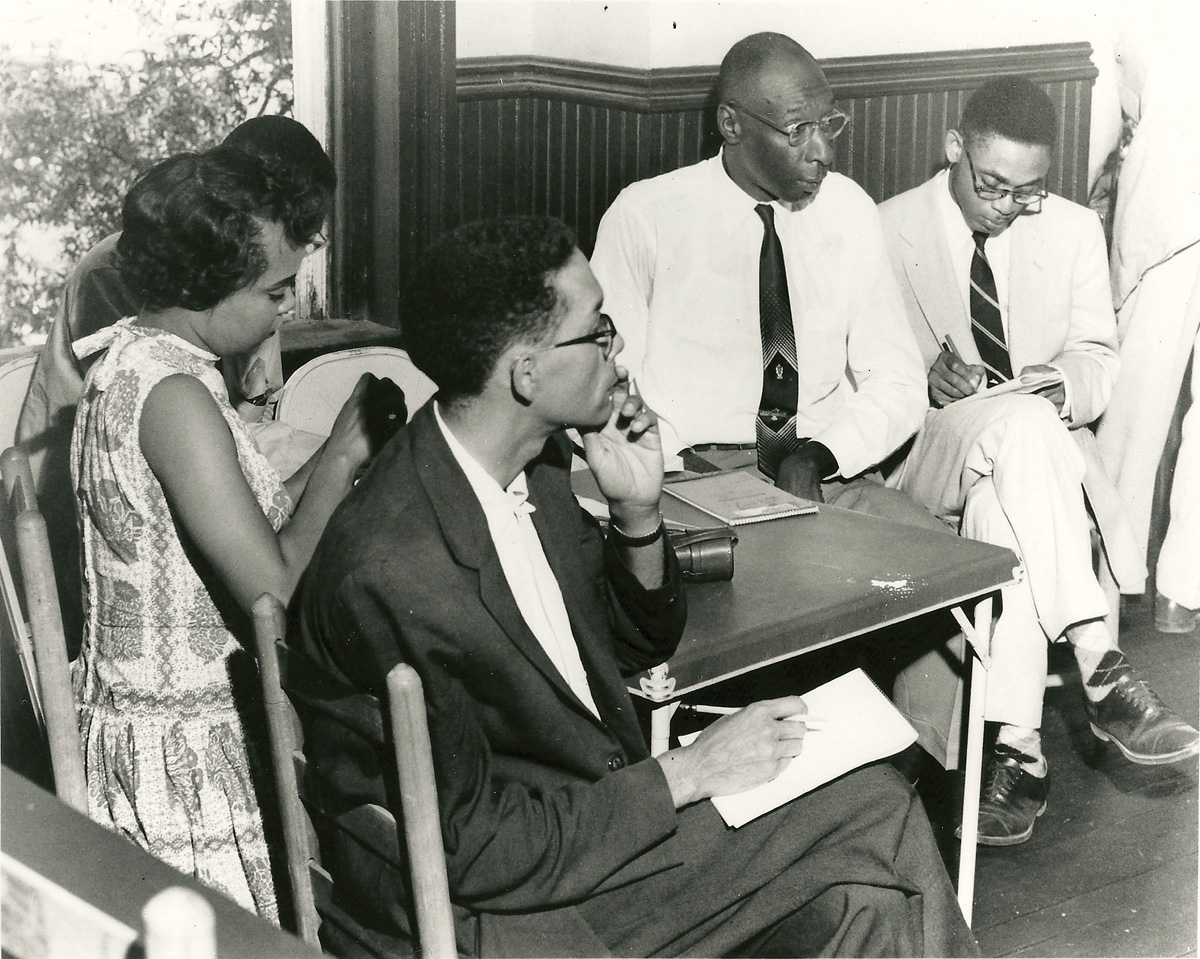 Simeon Booker, in dark jacket, in the Negro press section at the Emmett Till trial