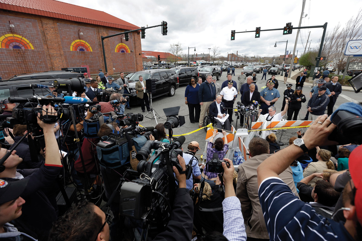 Massachusetts's governor Deval Patrick and Boston's mayor Thomas Menino address the media during the manhunt in Watertown