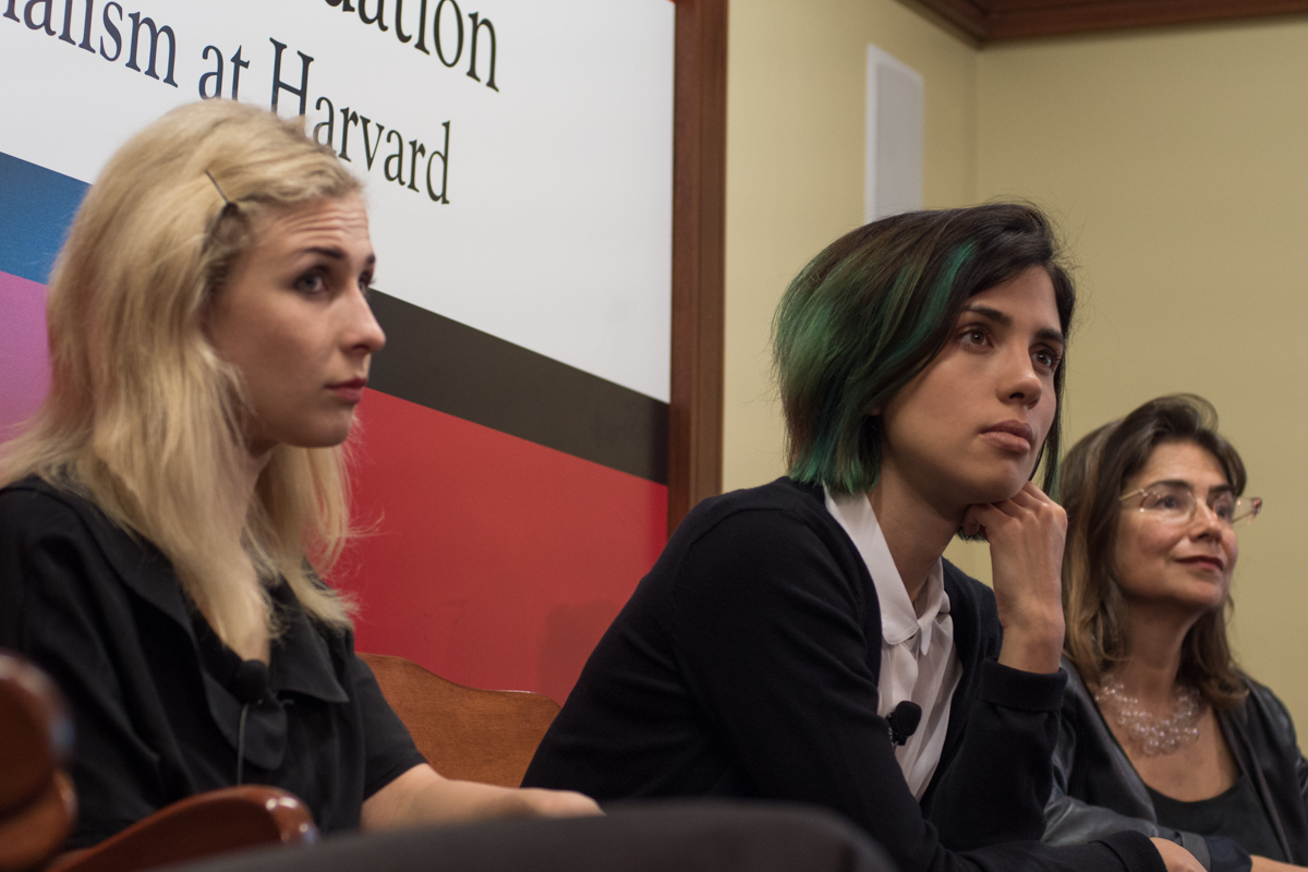 Masha Alyokhina, left, and Nadya Tolokonnikova, center, spoke about their new media venture covering "the areas that take away one's liberty" with Harvard professor Svetlana Boym