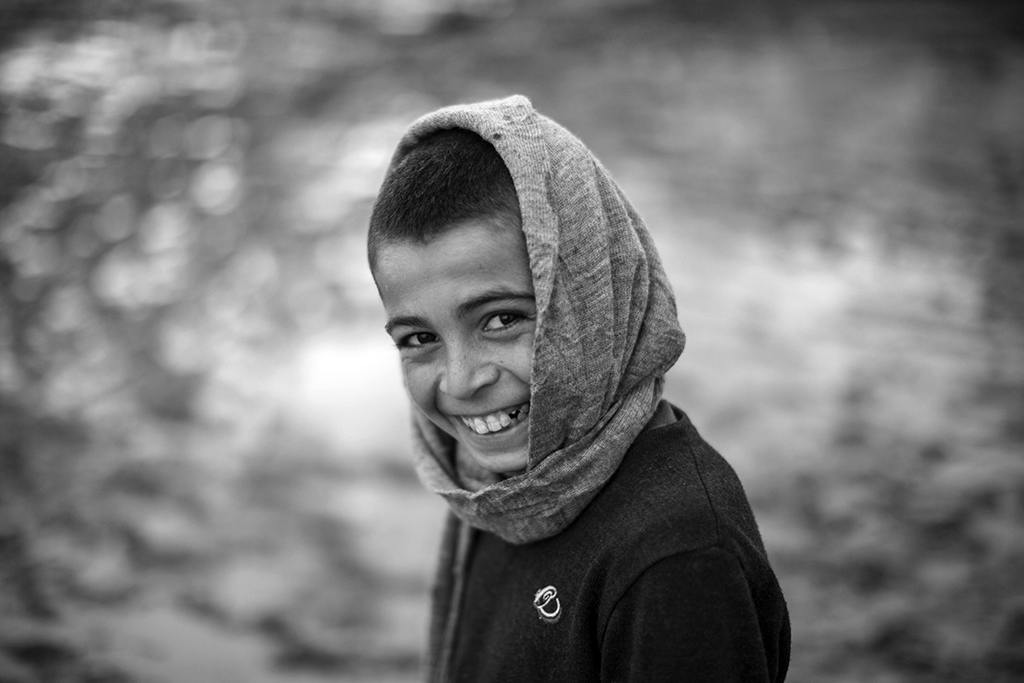 Hundreds of displaced Iraqis were living in the Baharka camp earlier this year. This smiling boy is just one of them. 