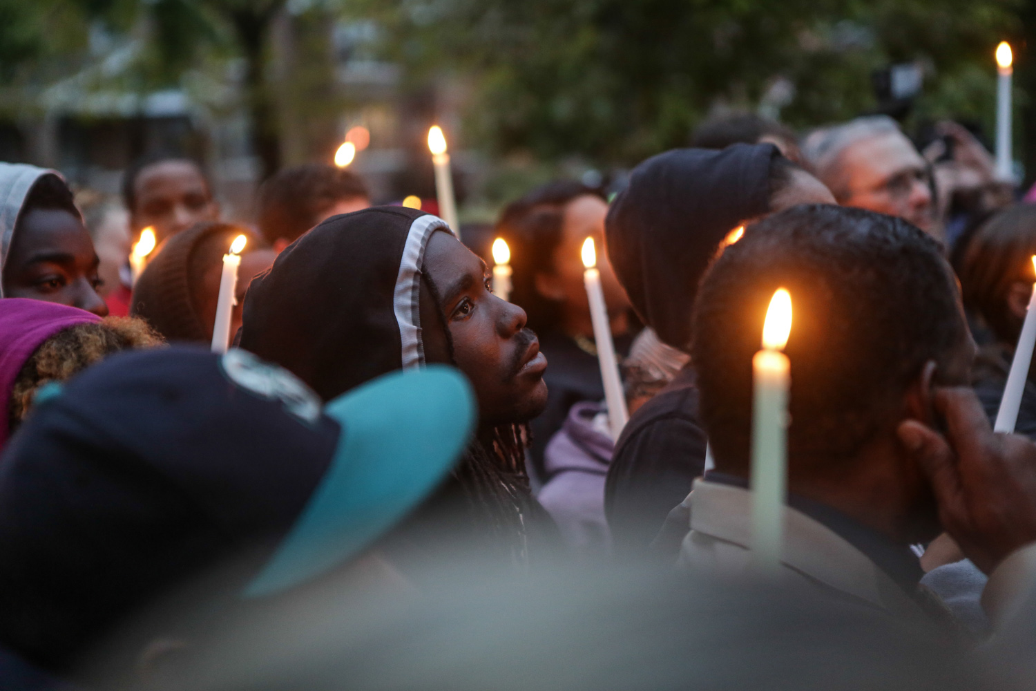 Community members hold a vigil last October for an 18-year-old shot and killed by an off-duty police officer in St. Louis. Police violence continues to be a major story for The St. Louis American