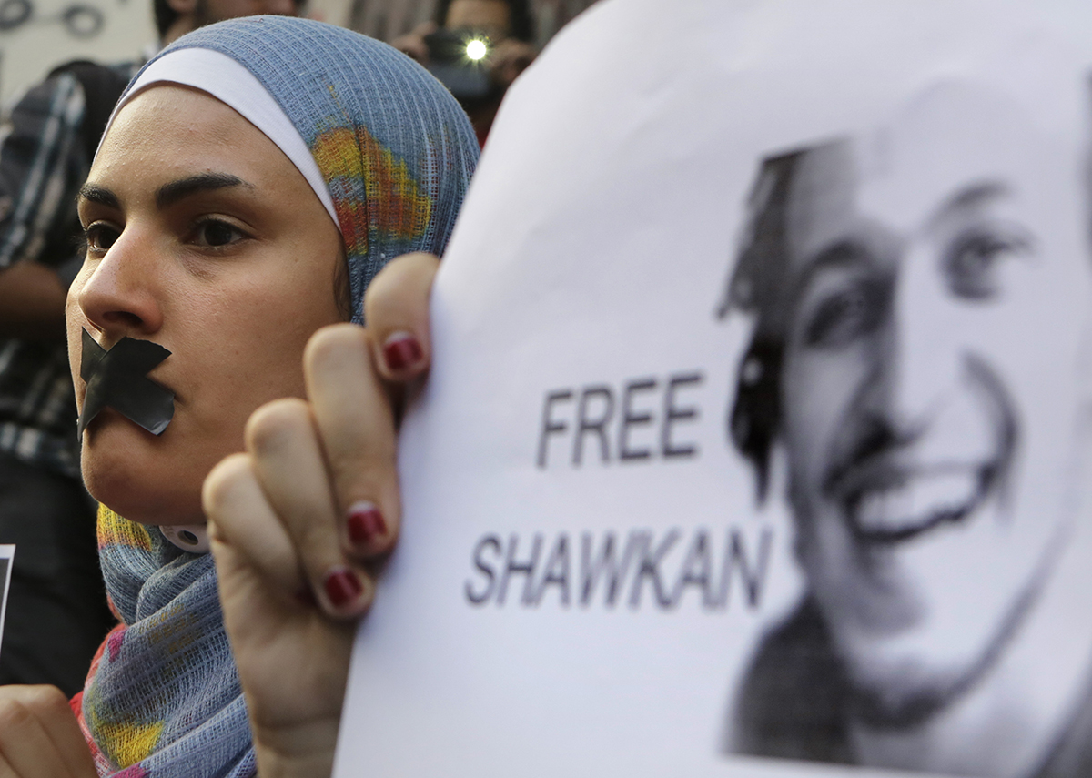 Protesters in Cairo last summer demand the release from prison of photographer Mahmoud Abou Zeid, known as Shawkan