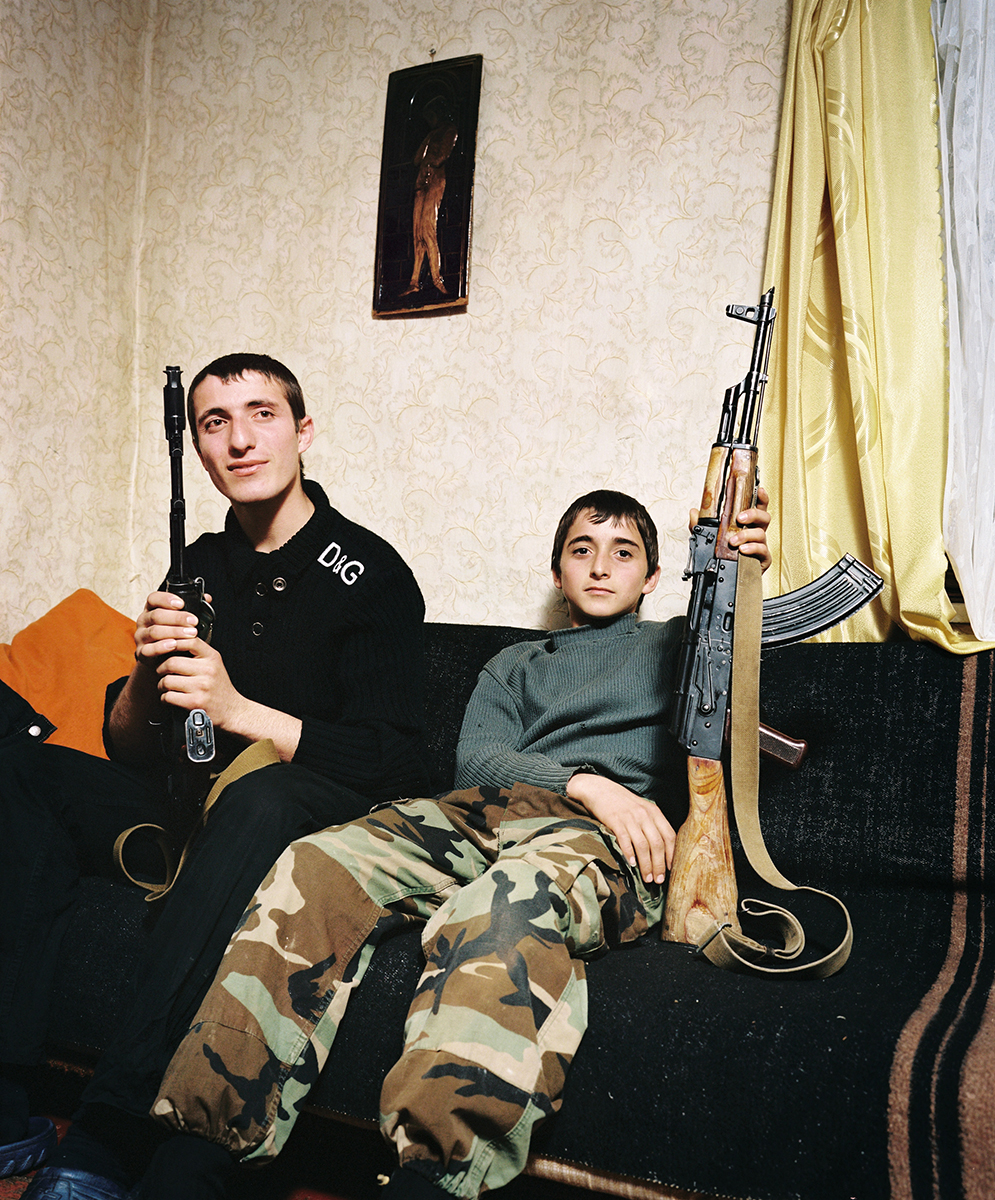Two brothers living in a disputed region of Georgia pose with Kalashnikovs for The Sochi Project