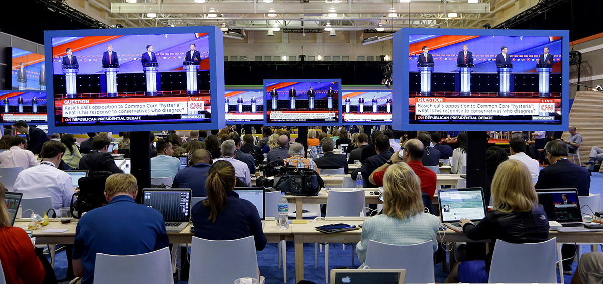 Reporters work in the media filing room during the Republican presidential debate sponsored by CNN, Salem Media Group and the Washington Times at the University of Miami, Thursday, March 10, 2016, in Coral Gables, Fla.