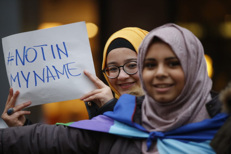 The sentiment of a sign in Milan is one expressed by many Muslims who say phrases like "Islamic terrorist" are incorrect, and that "mass murderers" or "criminals" might be more accurate.