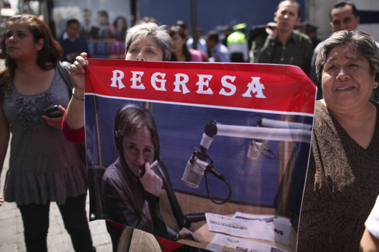 Protesters, outside the MVS radio station headquarters in Mexico City in February 2011, hold a sign that reads “Come back” and depicts Mexican journalist Carmen Aristegui, who said she was fired from the station for refusing to apologize for addressing a congressman's allegation that Mexico's President Felipe Calderon is an alcoholic