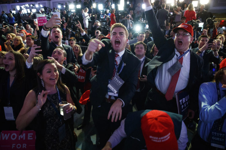 Supporters of Republican presidential candidate Donald Trump cheer as they watch election returns during an election night rally in New York