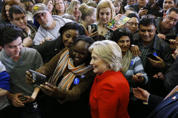 Democratic presidential candidate Hillary Clinton poses for a photo with an attendee after speaking at a town hall at Valley Southwoods Freshman High School in West Des Moines, Iowa in January