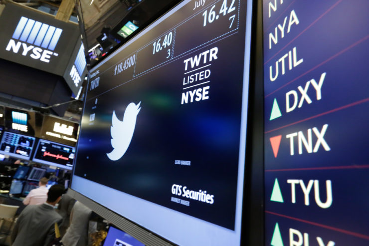 In this July 27, 2016 photo, the Twitter symbol appears above a trading post on the floor of the New York Stock Exchange