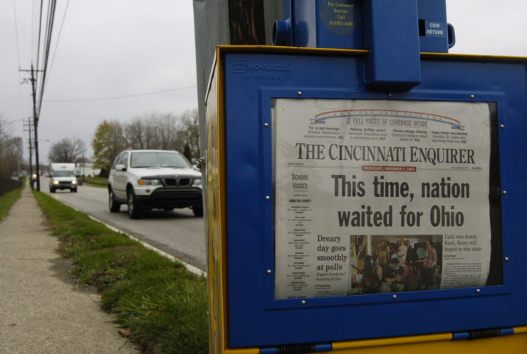 A copy of the Cincinnati Enquirer sits in a newspaper rack in Amelia, Ohio