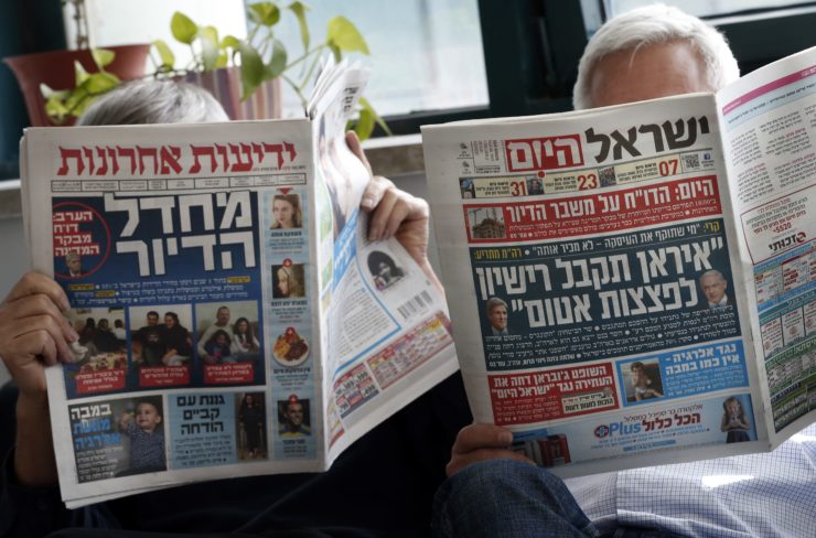 Though Benjamin Netanyahu has benefited from the support of free daily Israel Hayom (pictured, right), the prime minister seemed to suggest in leaked conversations with publisher Arnon Mozes that he could cut Hayom’s circulation in exchange for more favorable coverage in Mozes’ daily Yedioth Ahronoth (left)
