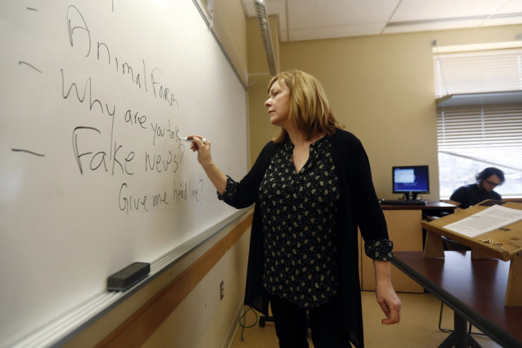 Teachers from elementary school through college, such as Kean University journalism professor Pat Winters Lauro, shown here, have been ramping up media literacy training in the classroom to help students identify and overcome the misinformation they encounter daily