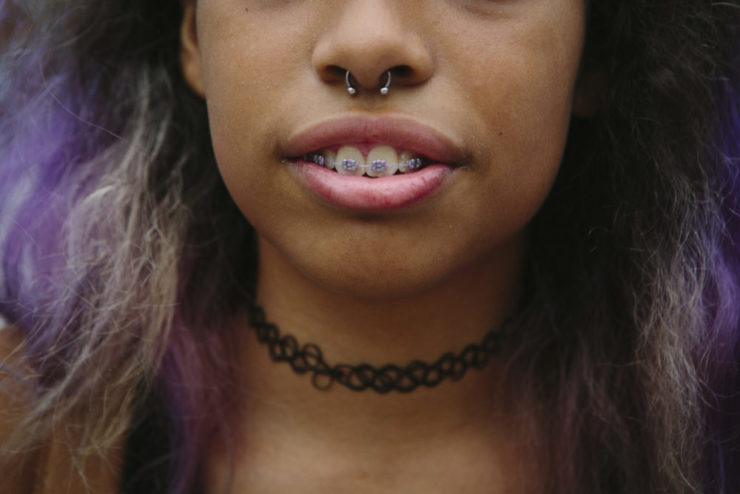 A detail of Arielle, 14, and her septum piercing as she hangs out with her friends after school in Brooklyn, New York 