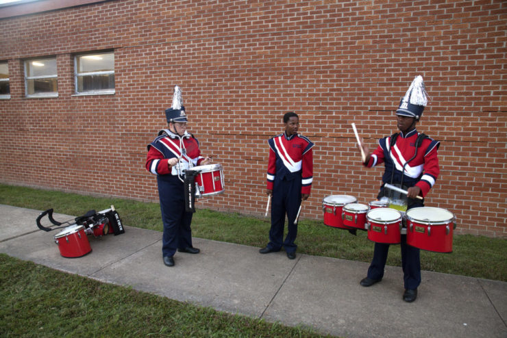 West Memphis (Ark.) Sr. High School Band members warm up before a Friday night football game
