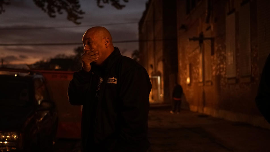 Benny Estrada tries to remain composed at the scene where a teen he mentored was killed on the east side of Chicago's Little Village. The lives of Estrada and Jorge Roque, both former gang members now working to promote peace in the neighborhood, were chronicled by the Chicago Tribune