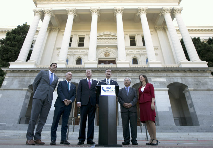 Los Angeles Mayor Eric Garcetti (third from right) and other California mayors urge lawmakers to address the state's housing shortage during a news conference in Sacramento in August