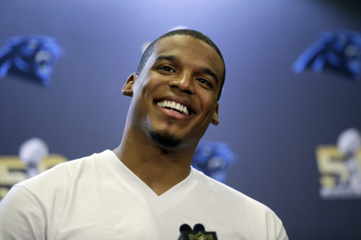 Carolina Panthers quarterback Cam Newton smiles as he answers questions during a press conference in San Jose, California in 2016