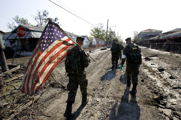 U.S. media often publish images featuring symbols of America’s strength, such as this flag rescued from a flood-ravaged home in New Orleans after Hurricane Katrina, in the wake of domestic disasters—a stark contrast to the photos of corpses they frequently publish after similar foreign tragedies