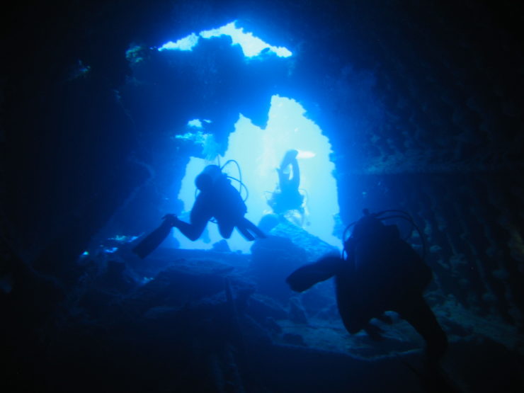 Joan Martelli diving inside the bow of the wreck the RMS Rhone