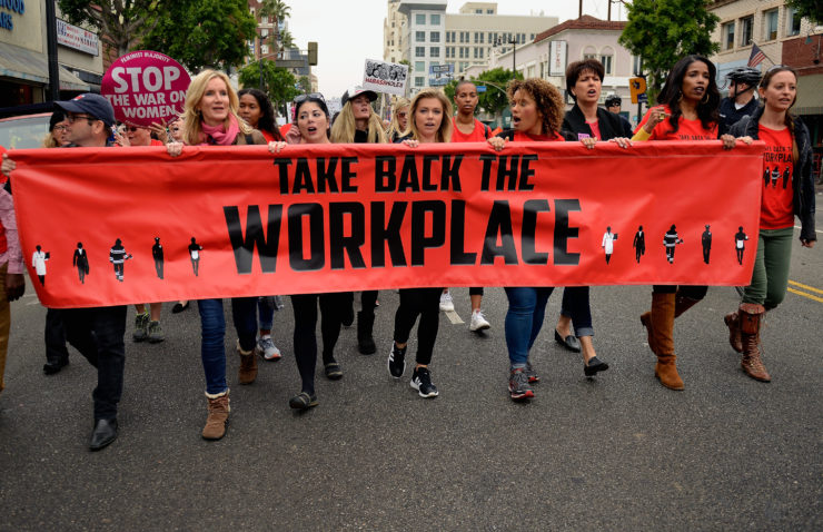 Women participate in the Take Back The Workplace March on November 12 in Los Angeles.