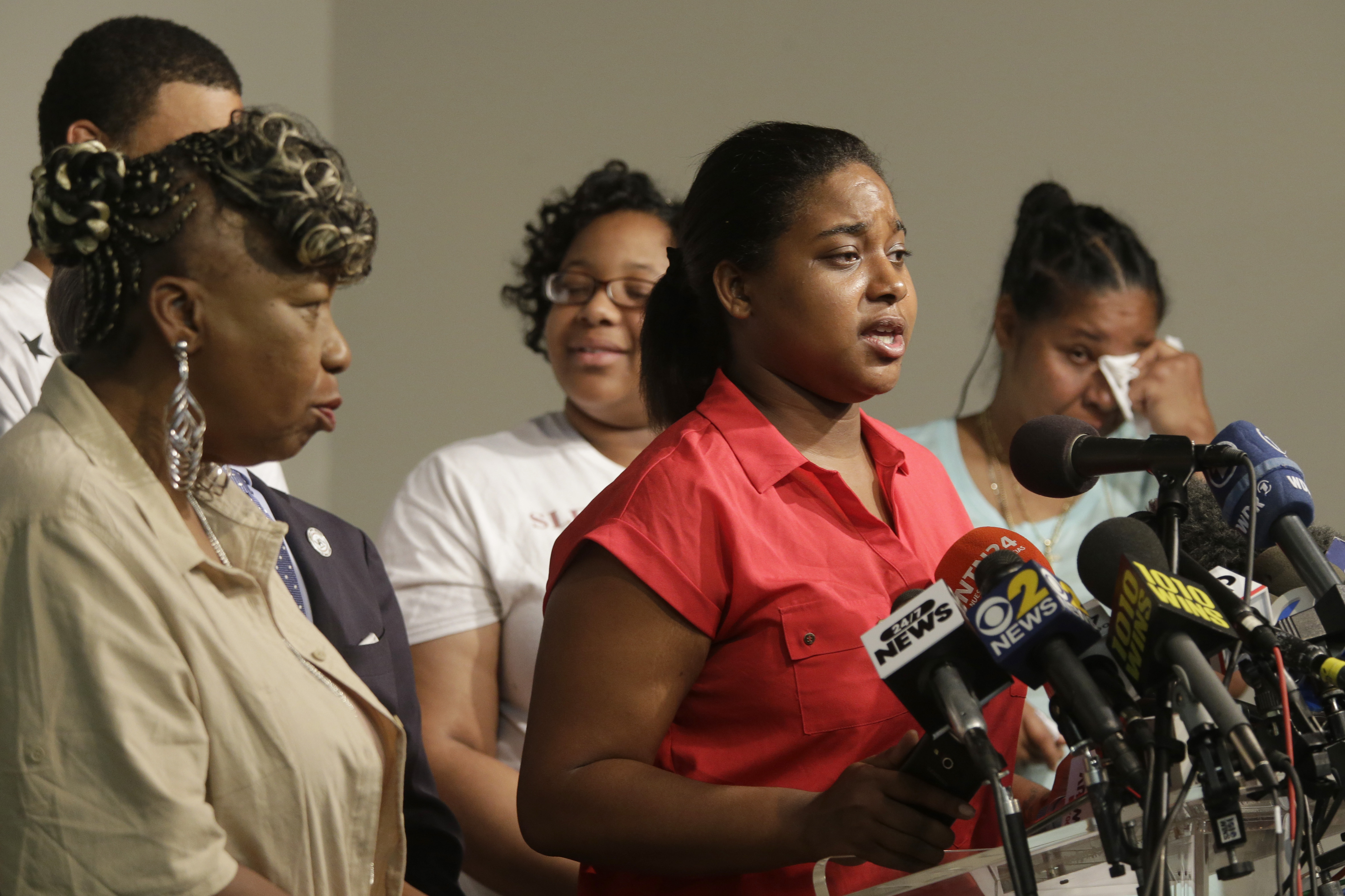 Eric Garner's daughter Erica Garner, center, is joined by family members as she speaks during a news conference in 2015. Controversy was recently sparked when, following her death in December, an associate of Erica’s requested that only black journalists reach out to her family with interview requests
