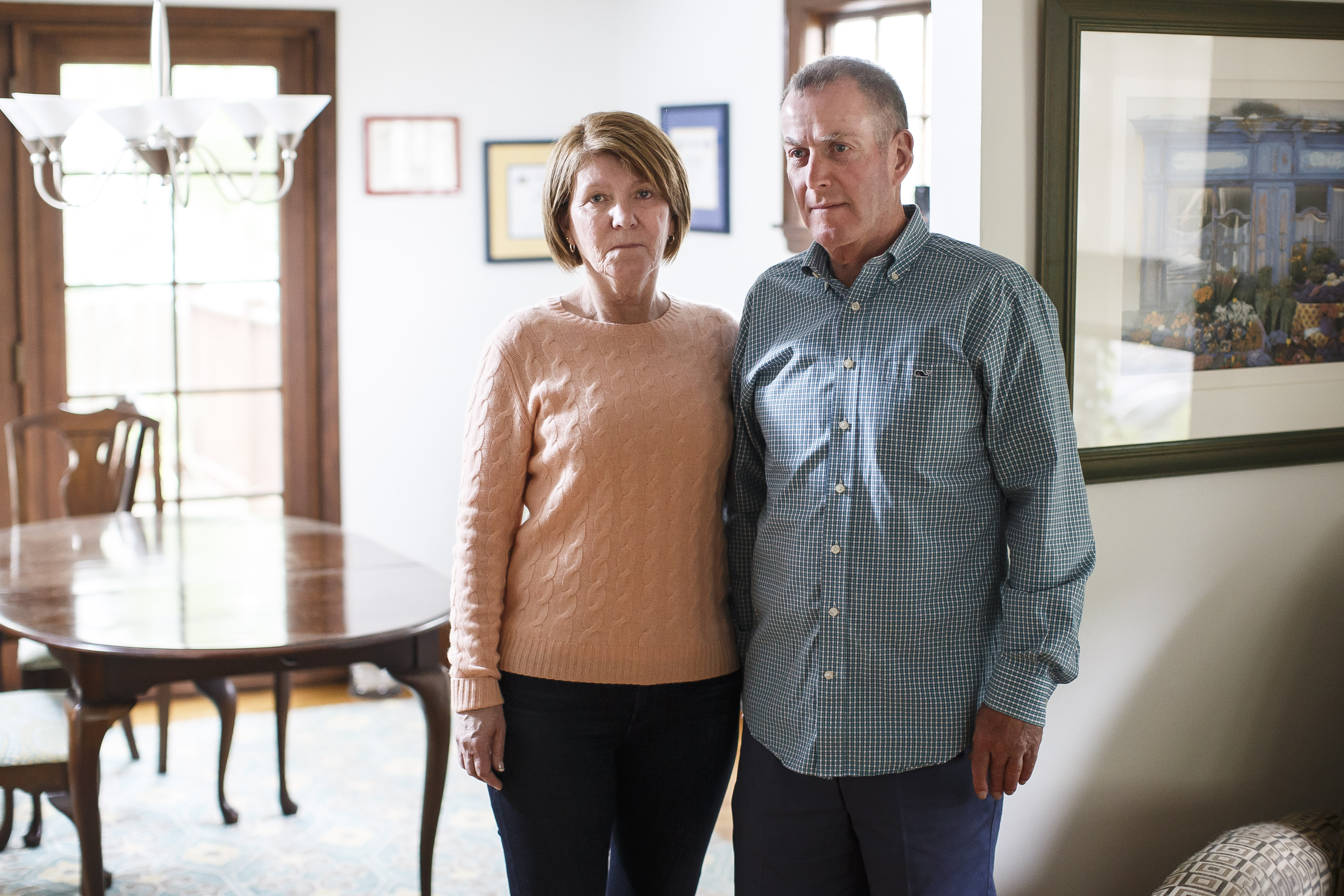 Maureen and Jack Graney, whose son Patrick died after being sent to a rehab facility in Florida, pose in their Massachusetts home. The Boston Globe and their partner STAT are among the media outlets that have reported on the practice of patient brokering, where middlemen collect fees to refer out-of-state clients to rehab centers in places like Florida