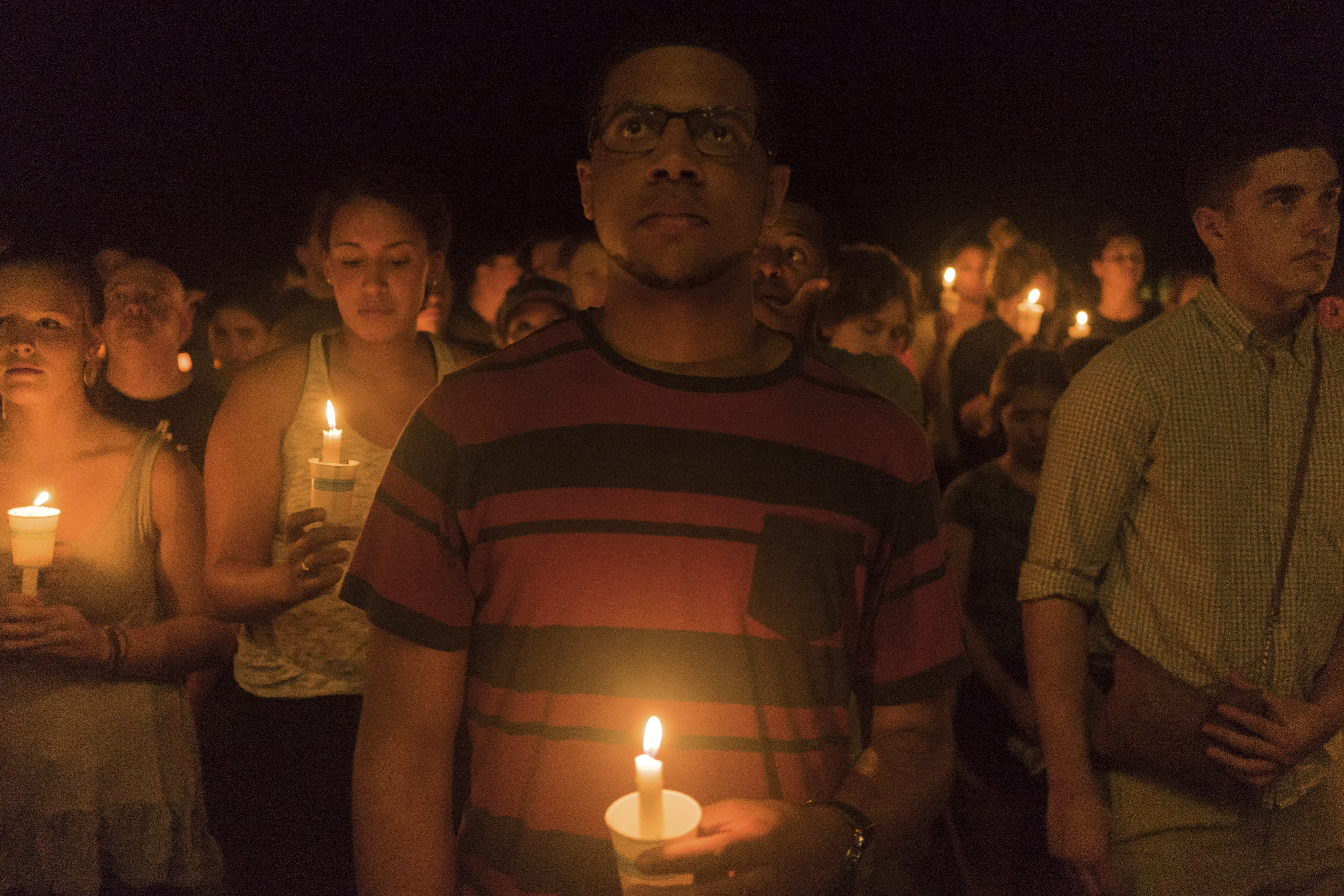 People gather for a candlelight vigil on the University of Virginia campus in Charlottesville on August 16, striking a peaceful contrast to the torches wielded by white supremacists days before