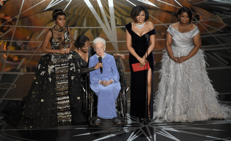 Janelle Monáe, Taraji P. Henson, and Octavia Spencer introduce Katherine Johnson, seated, the inspiration for "Hidden Figures," at the 2017 Oscars in Los Angeles. “Hidden Figures” was based on Margot Lee Shetterly’s nonfiction bestseller of the same name, though some of the film's scenes and characters were fictionalized