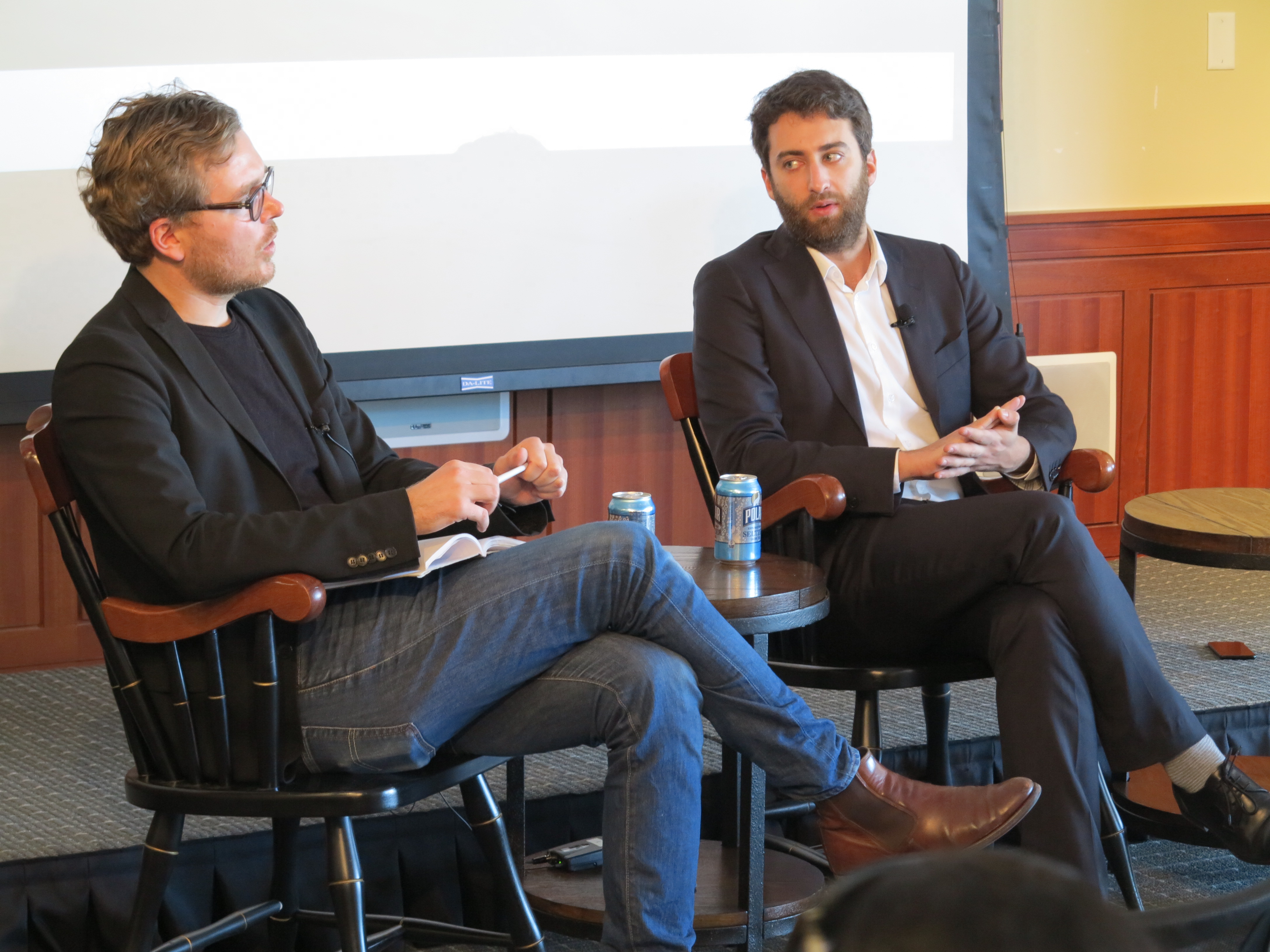 Matthew Caruana Galizia, right, speaks with Frederik Obermaier during a visit to the Nieman Foundation in February 