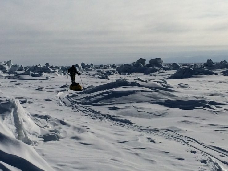 A polar training student travels through rough ice.