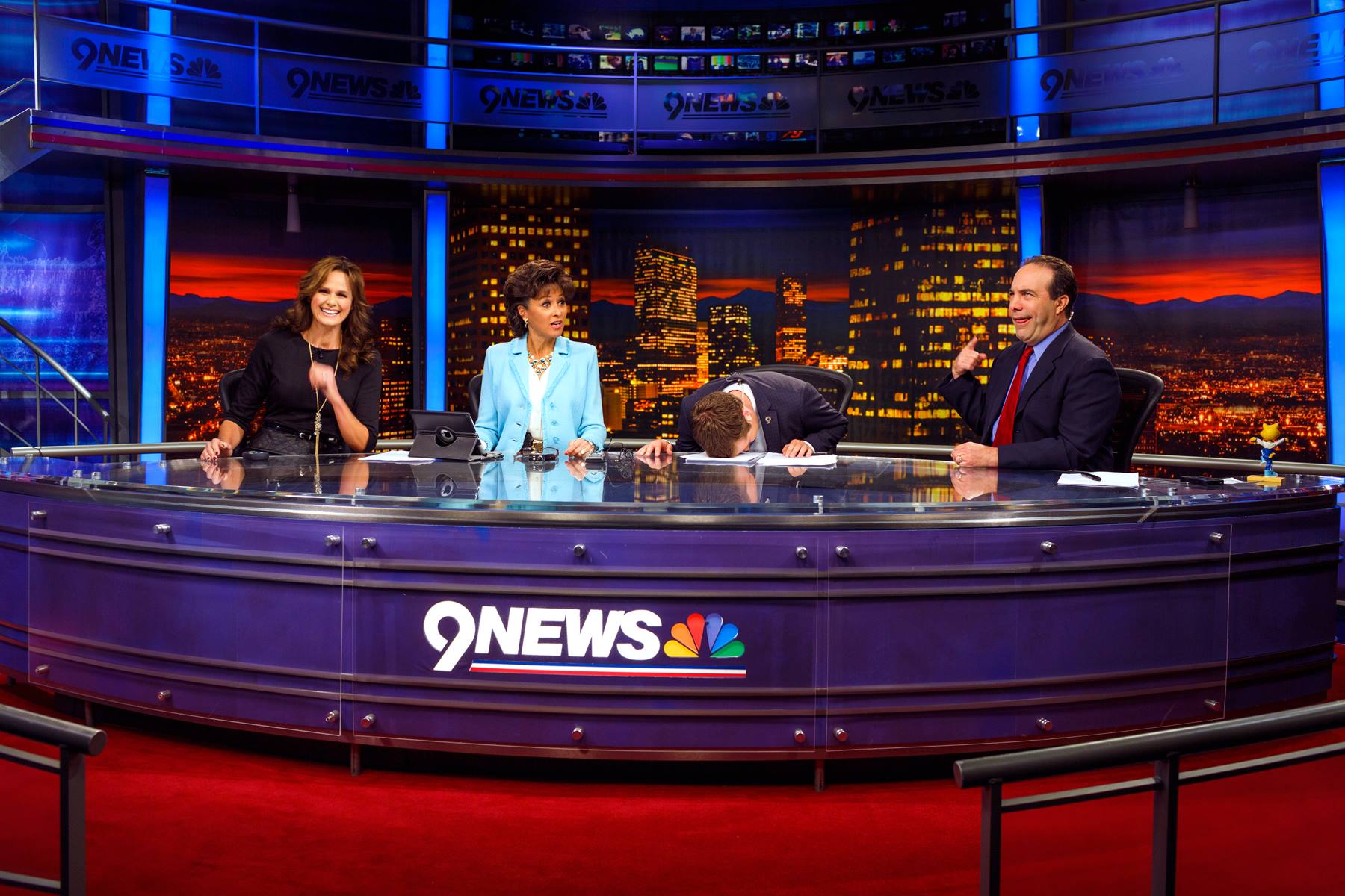 Kyle Clark (face-down) is the host of “Next with Kyle Clark,” a personality-driven reinvention of the 6 p.m. news broadcast on Denver’s KUSA 9News