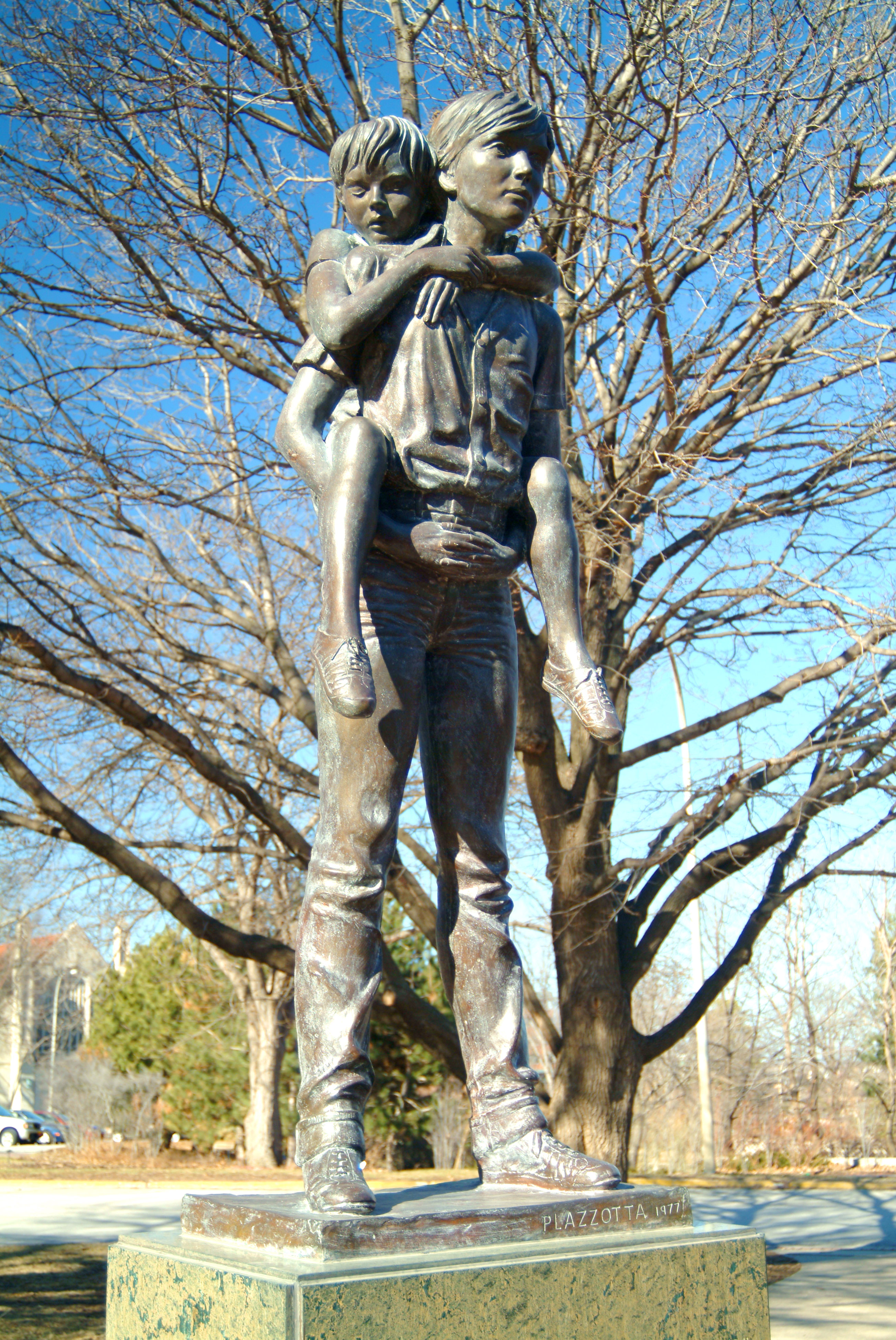 Boys Town’s motto, “He ain't heavy, Father, he’s my brother,” inspired 
this statue