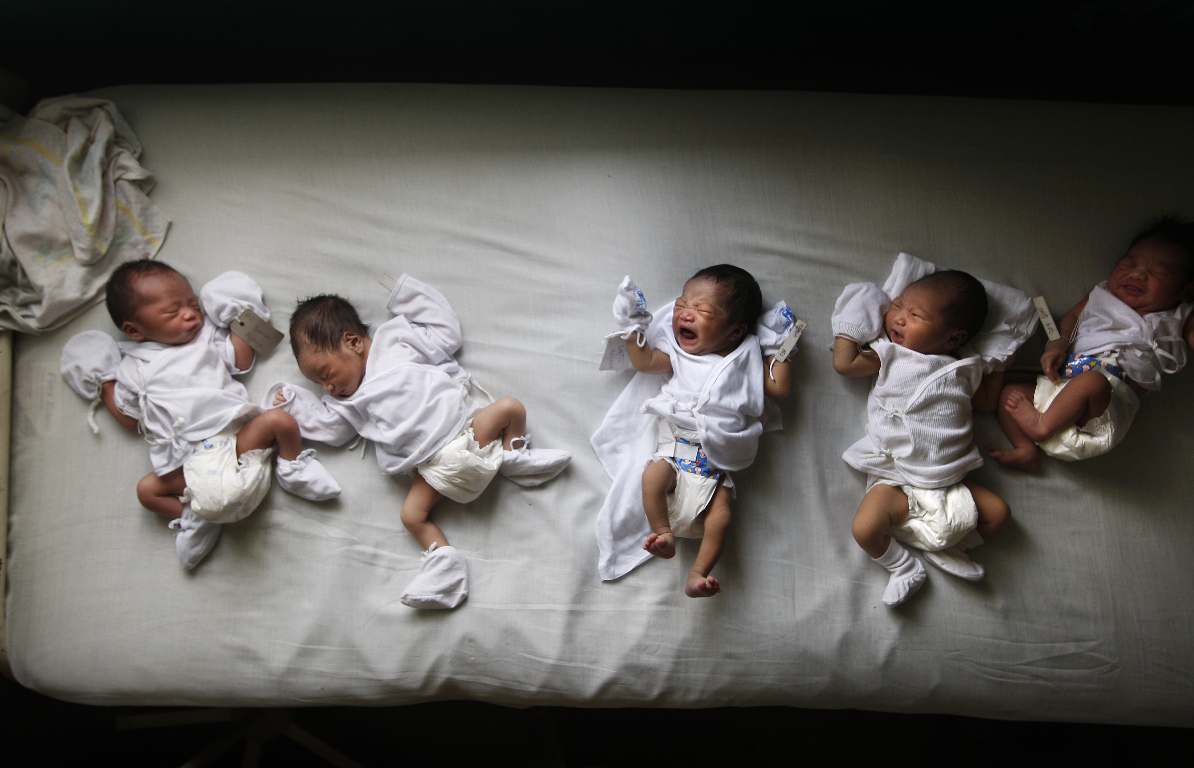Newborns are lined up side by side in Dr. Jose Fabella Memorial Hospital, a fraction of the 50 to 100 babies born there everyday. The hospital is sometimes dubbed the "baby factory" because of the sheer volume of children being born there