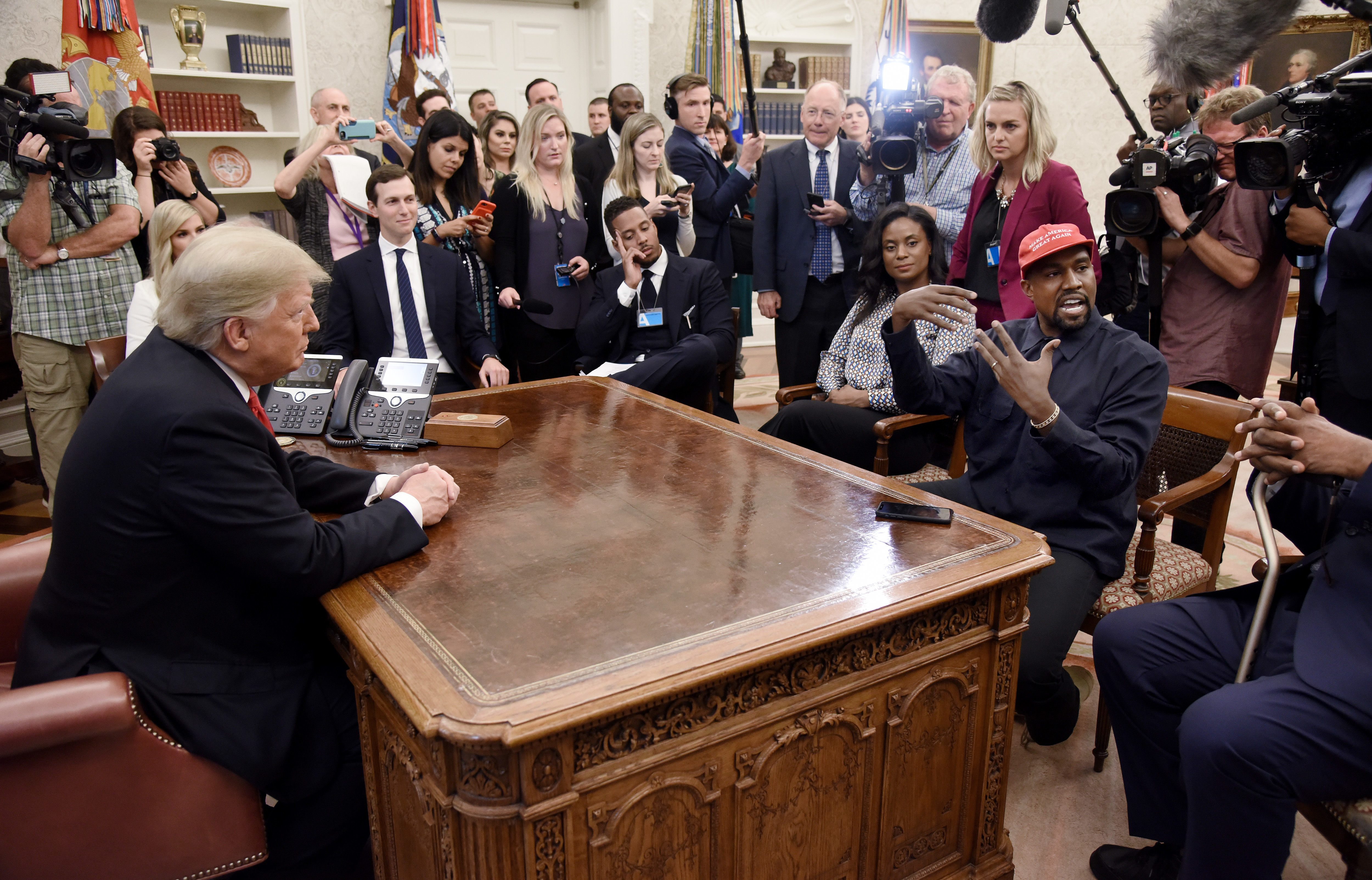 U.S. President Donald Trump meets with Kanye West in the Oval Office of the White House on October 11, 2018 to discuss the criminal justice system and prison reform 