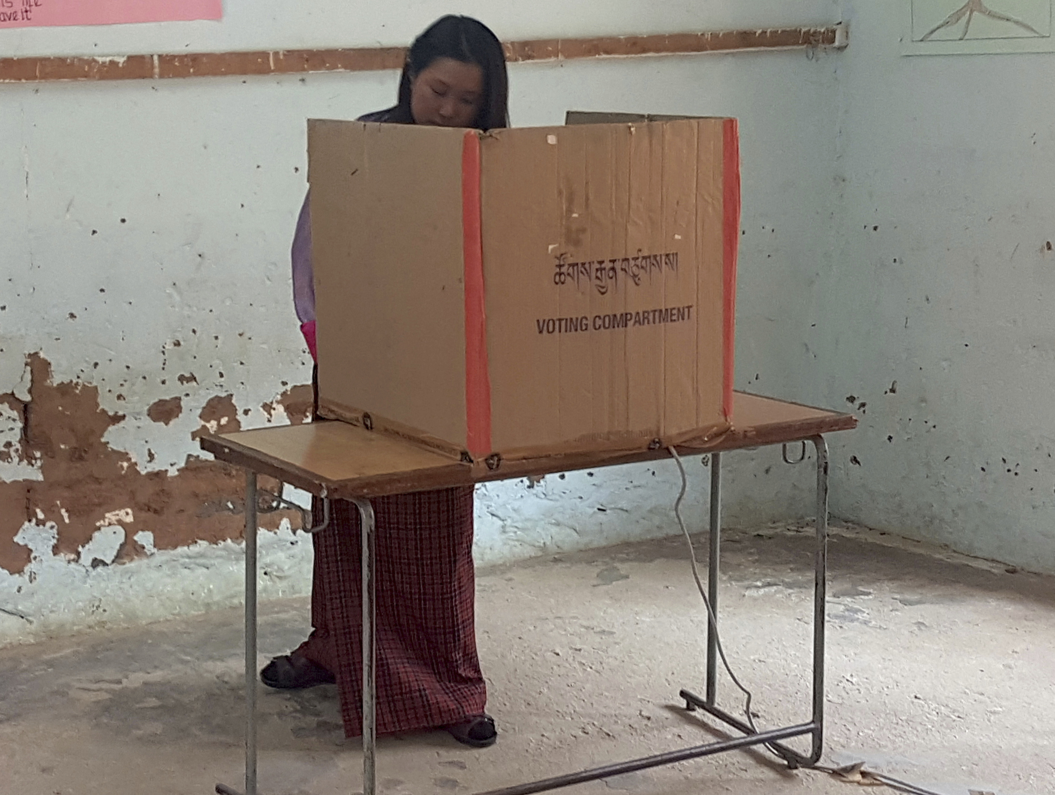 A woman votes in a polling station in Bhutan's capital Thimphu for the parliamentary elections in October 2018, when the small Himalayan kingdom held its third election since the elimination of the absolute monarchy