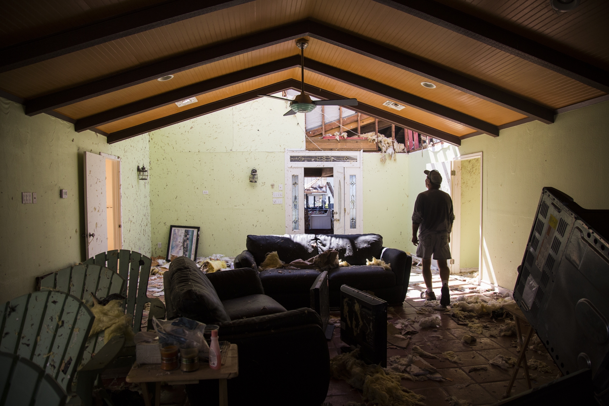 Dennis Young, 63, walks through his waterfront home in Rockport, Texas in September 2017 after it was destroyed by Hurricane Harvey. In their series "Hidden in Plain Sight," the Advocate takes a look at income inequality worsened by the hurricane