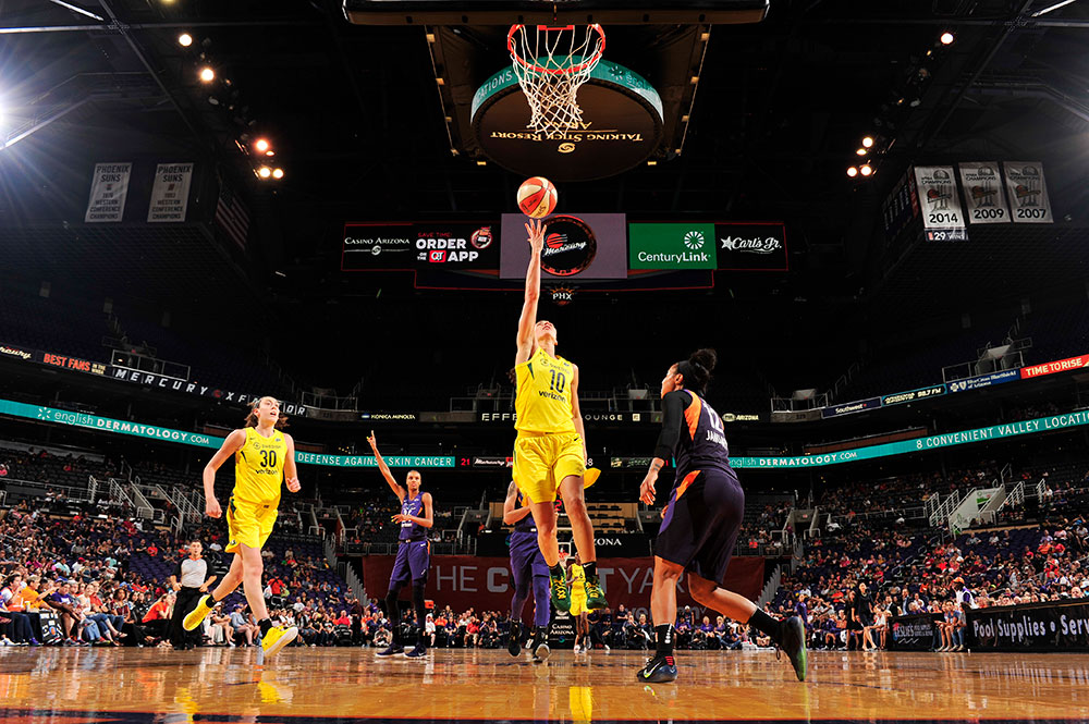 Sue Bird of the Seattle Storm goes for the basket in a July 2018 game against the Phoenix Mercury in Phoenix, Arizona. The Seattle Times's coverage of Bird and the Seattle Storm offers a model of consistency rarely seen in a legacy outlet's coverage of women's sports